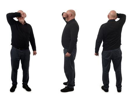 side, back and front view of same man covering his face with his arm on white backgroundの写真素材