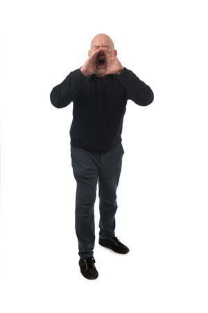 front view of a standing man who is screaming on white backgroundの写真素材
