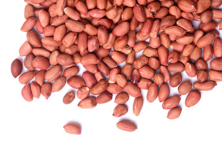 raw peanuts on white background
