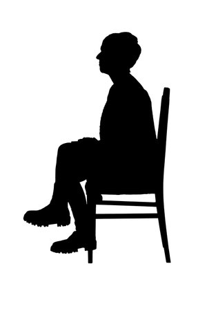 silhouette of side view of a woman sitting on chair cross leggedの写真素材