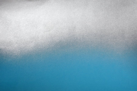 blue paper with silver spray paint