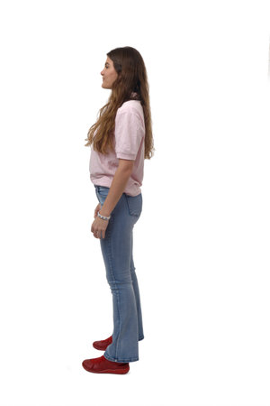 side view of a young girl standing on white backgroundの写真素材