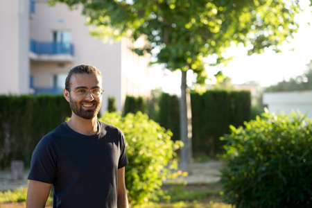 A man in the park smiling