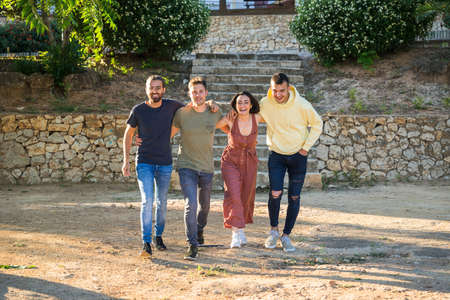 Friends walking together in the park