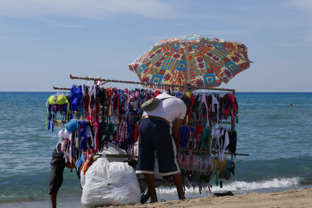 Clothing seller with cart on the beach at the Mediterranean Sea.の写真素材