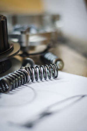 Close up of a metal spring on a workshopの写真素材