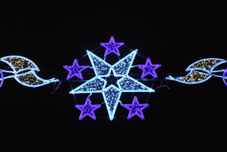 City street illuminated with Christmas bulbs