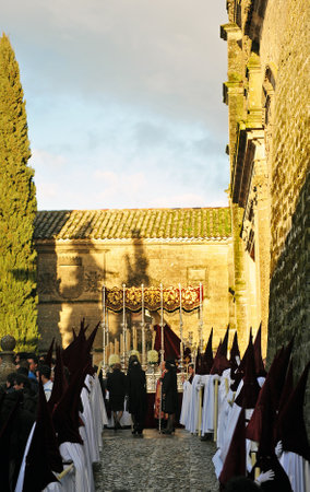 Holy Week in Baeza, Andalusia, nazarenes with candles in hand, Spainのeditorial素材