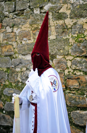 Holy Week in Baeza, Andalusia, nazarenes with candles in hand, Spain