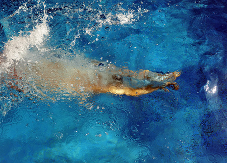 Child in the pool during the summer holidays