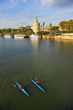 The Guadalquivir river passing through the city of Seville, Torre del Oro, Andalusia, Spain