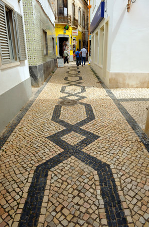 Shopping street, stoned portuguese, Olhao, Algarve, south of Portugalのeditorial素材