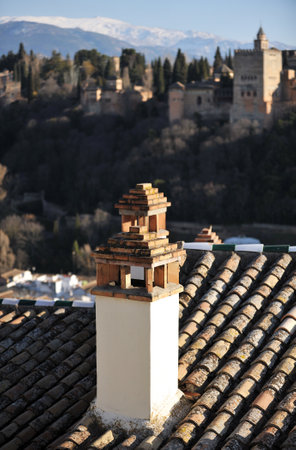Roofs and chimneys of the Albaicin, Palace of the Alhambra in Granada viewed from the Mirador de San Nicolas, Granada, Andalusia, Spainのeditorial素材
