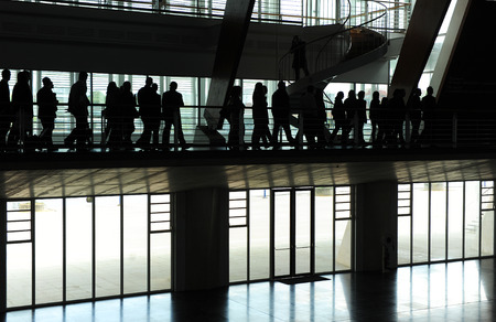 Group of business people at a convention center, people silhouettes