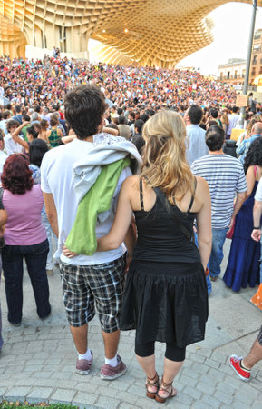 Young couple in the crowd, popular expression, claims peopleのeditorial素材
