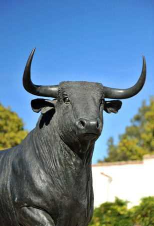 Fighting bull, bronze sculpture, bullring of Ronda, Andalusia, Spainの写真素材