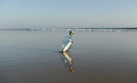 50 euro bills in a bottle found on the beachの写真素材