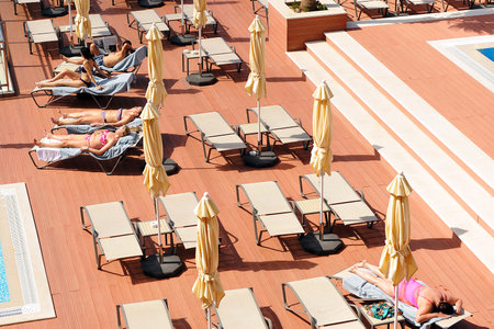Terrace with loungers and parasols in the hotel swimming poolのeditorial素材