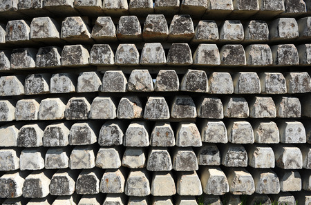 Concrete sleepers stacked outdoors, railroad material obsoleteの写真素材