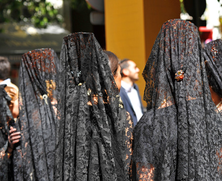 Women with veil and ornamental comb for Good Friday, Holy Week, Seville, Spainの写真素材