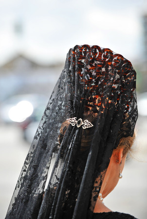 Woman with veil and ornamental comb for Good Friday, Holy Week, Seville, Spainの写真素材