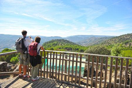 Couple of hikers in the Sierra de Andujar Natural Park, Sierra Morena, province of Jaen, Spainのeditorial素材