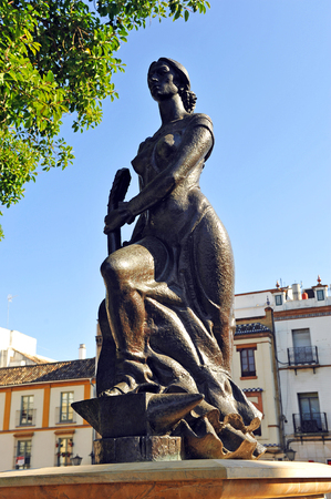 Tribute to flamenco, Andalusian woman with guitar in the neighborhood of Triana, Seville, Spainの写真素材