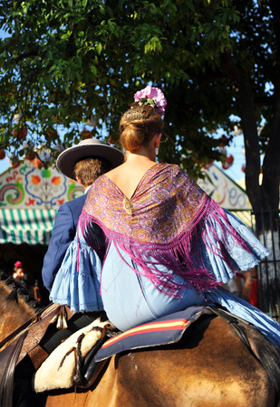 Fiesta in Spain, young couple riding in the Seville Fairの写真素材
