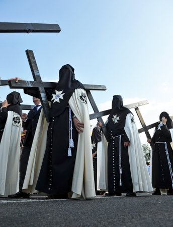 Holy Week in Seville (Semana Santa), Nazarenes with crosses of penance, Andalusia, Spainのeditorial素材