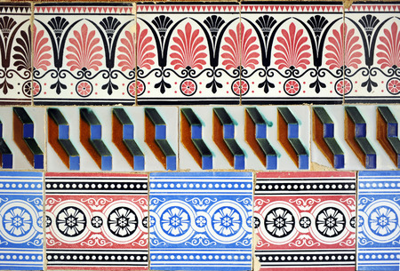 composition of polychrome tiles (azulejos) of various designs reused, vintage decorative detail, Cartuja, Seville, Spainの写真素材