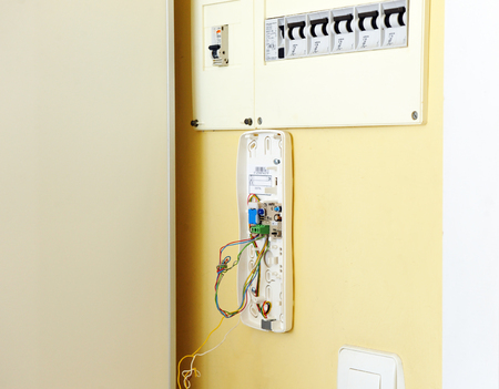 Technician placing the new intercom phone