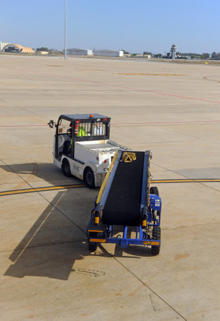 Loading of the luggage in the airplane, Seville Airport, Spainのeditorial素材