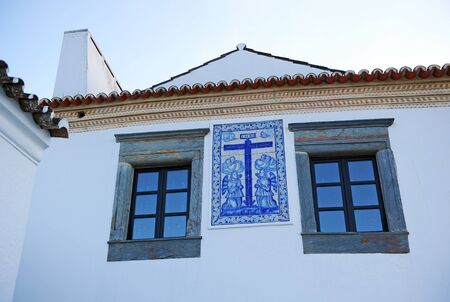 Religious altarpiece of portuguese tiles in a house of Monsaraz one of the most beautiful villages in Alentejo Portugal southern Europeの写真素材