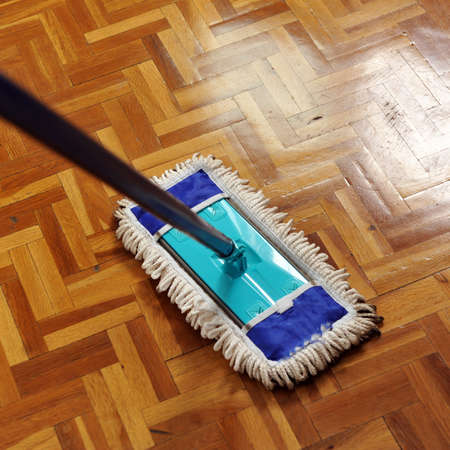 Mop washing a wooden floor, house cleaningの写真素材