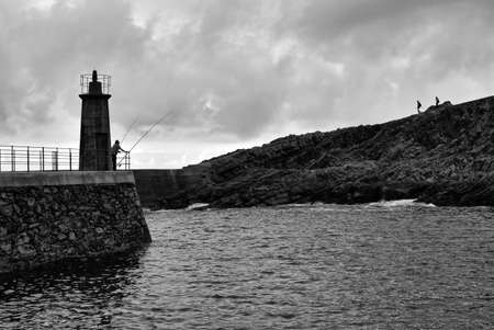 fishermen in the seaport in black and whiteの写真素材