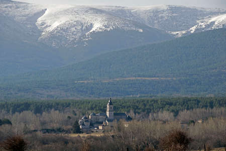View of a monastery guarded by the mountains in the backgroundの写真素材