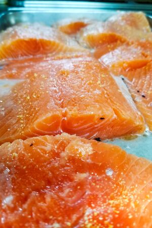 salmon fillet on a metal tray