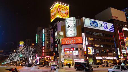 Night scene along the street filled with snow on snowy night during year end winter time. January 2017, Sapporo, Hokkaido, Japanのeditorial素材