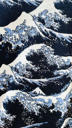 Abstract and artistic blue and white waves background pattern printed on fabricの写真素材