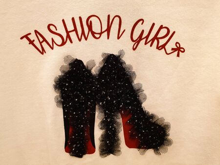 Handmade fashion art work with printing of fashion girl slogan and black high heel stitched with black lace and embellishmentsの写真素材