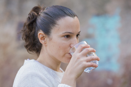 Girl drinking water.の写真素材