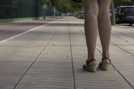 Girl walking in street of Castellon, Spain.の写真素材