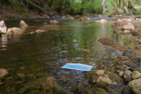 Mask abandoned in the river.