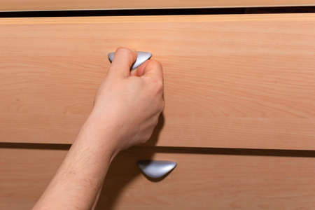 Opening a drawer.