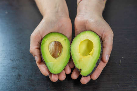 Avocados in hand