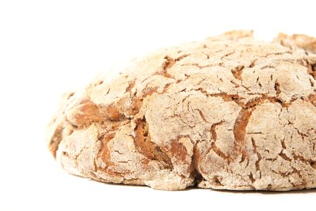 close-up loaf of hot whole rye homemade bread just out of oven and isolated on white backgroundの写真素材