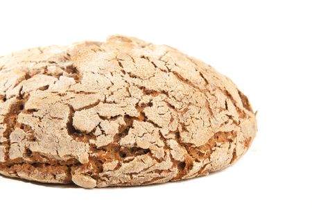 close-up loaf of hot whole rye homemade bread just out of oven and isolated on white backgroundの写真素材