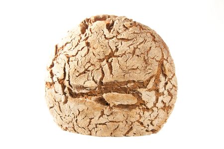 close-up of cutted loaf of hot whole rye homemade bread just out of oven and isolated on white backgroundの写真素材