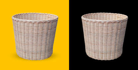Cane Wicker Basket Isolated On yellow and black Backgroundの写真素材