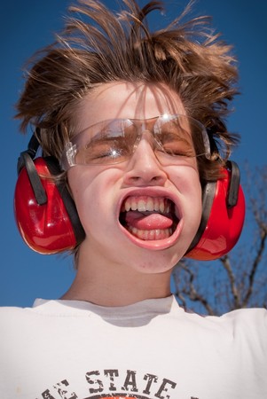 Young boy being blown away by high speed air.